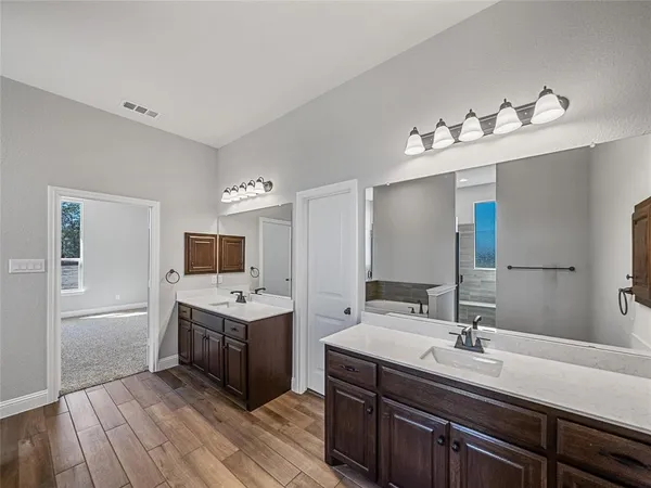 a kitchen with a sink and cabinets