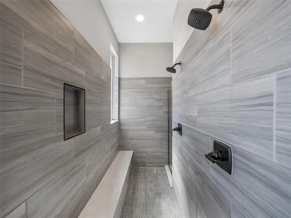 a bathroom with a sink and a wooden floor