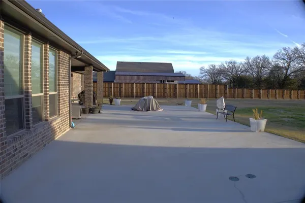 a view of a big house with a yard