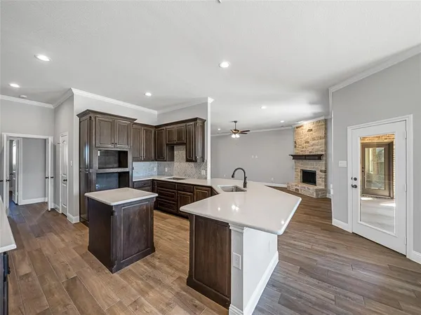 a kitchen with stainless steel appliances a sink and a refrigerator