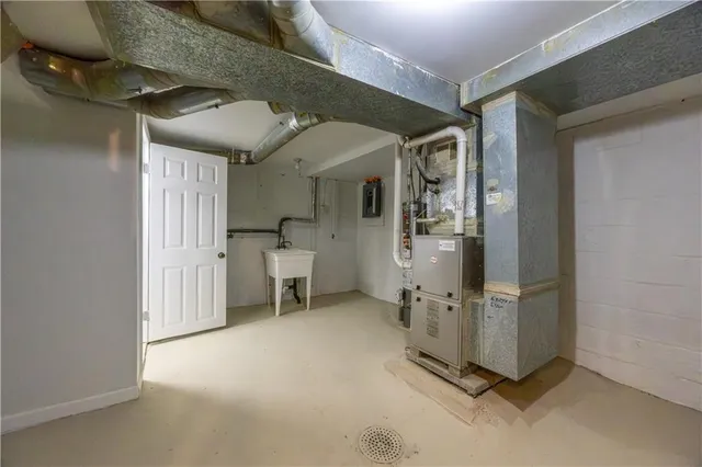 an entryway and livingroom with furniture