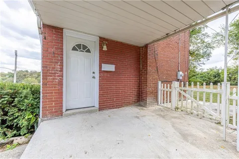 a view of backyard with lake and trees in the background