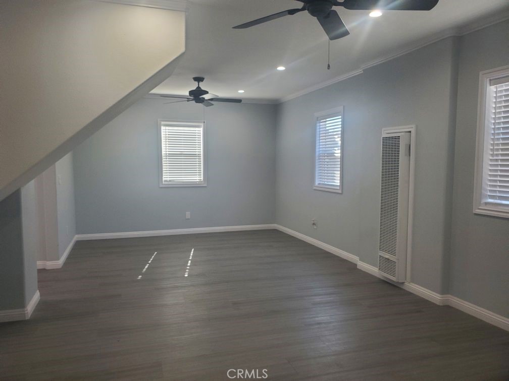 125 East Alondra Boulevard Compton, CA 90220 - Photo 20 of 24 an empty room with wooden floor and windows
