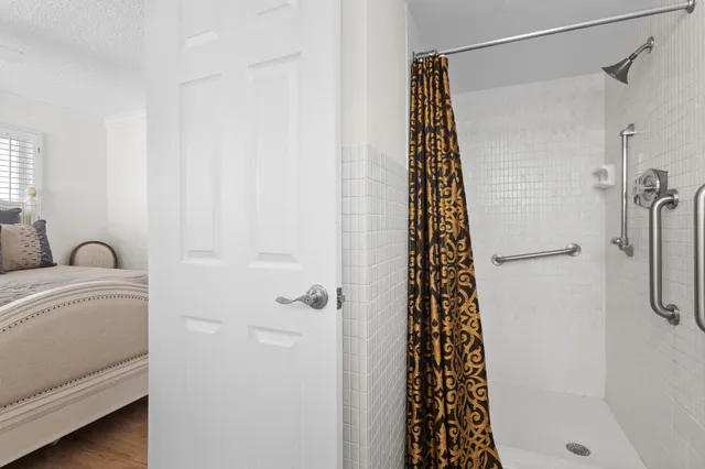 a bathroom with a bathtub and shower