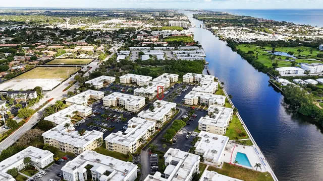 a picture of houses with outdoor space and lake view
