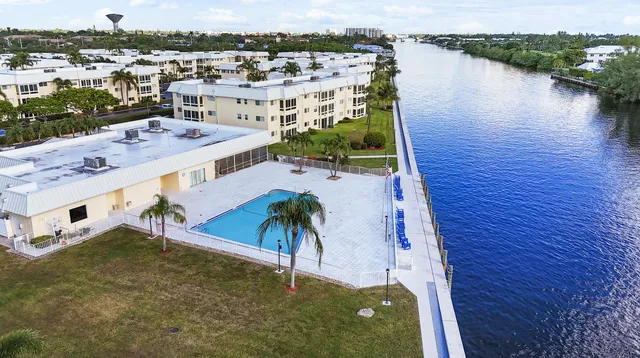 a kitchen with stainless steel appliances granite countertop a stove and white cabinets