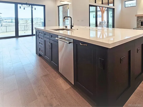 a bathroom with a double vanity sink and a large mirror