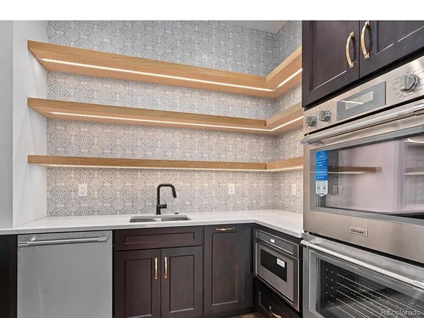 a kitchen with a sink and cabinets