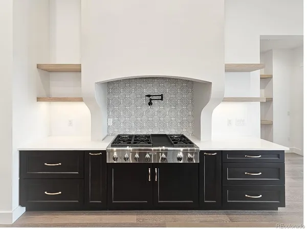 a kitchen with a stove and a cabinet
