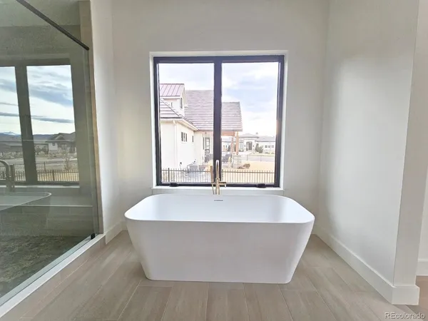 a white bath tub sitting in a bathroom