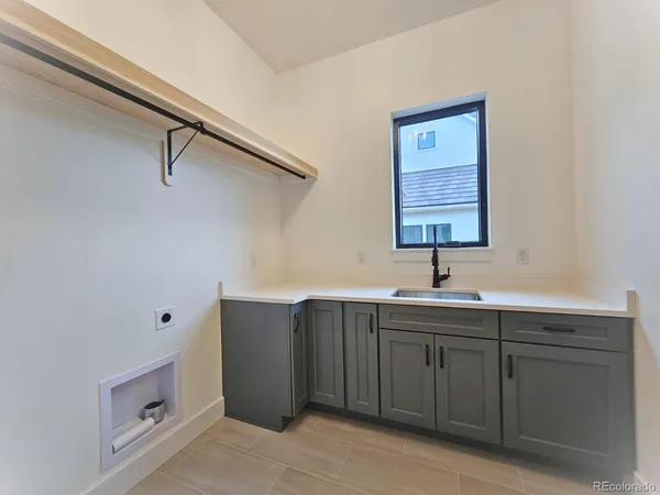 a bathroom with a double vanity sink and mirror
