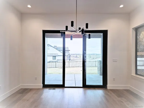 a view of room with wooden floor