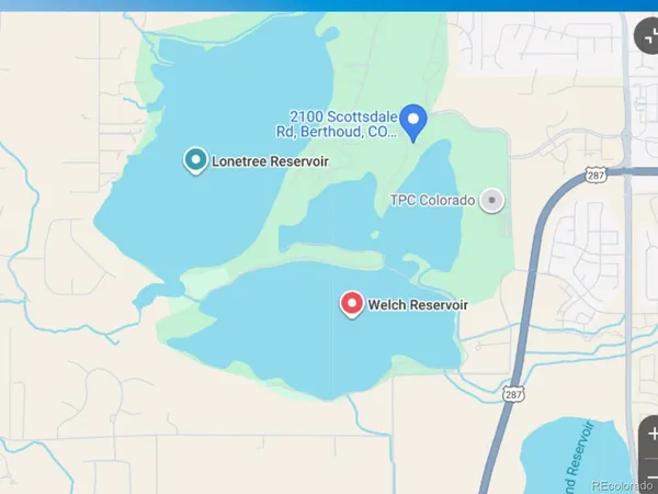 a close up of a sink and a utility room with a washer and dryer