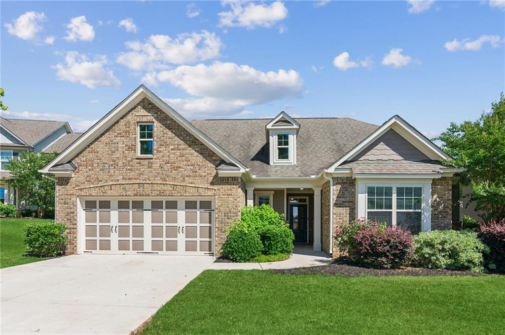 a front view of a house with a yard