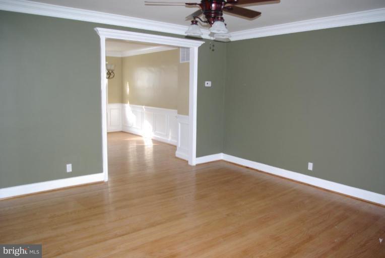 4676 Marble Hall Road Baltimore, MD 21239 - Photo 2 of 20 a view of an empty room and window