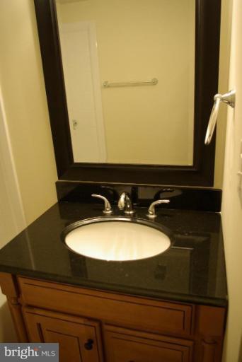 4676 Marble Hall Road Baltimore, MD 21239 - Photo 4 of 20 a bathroom with a sink and a mirror