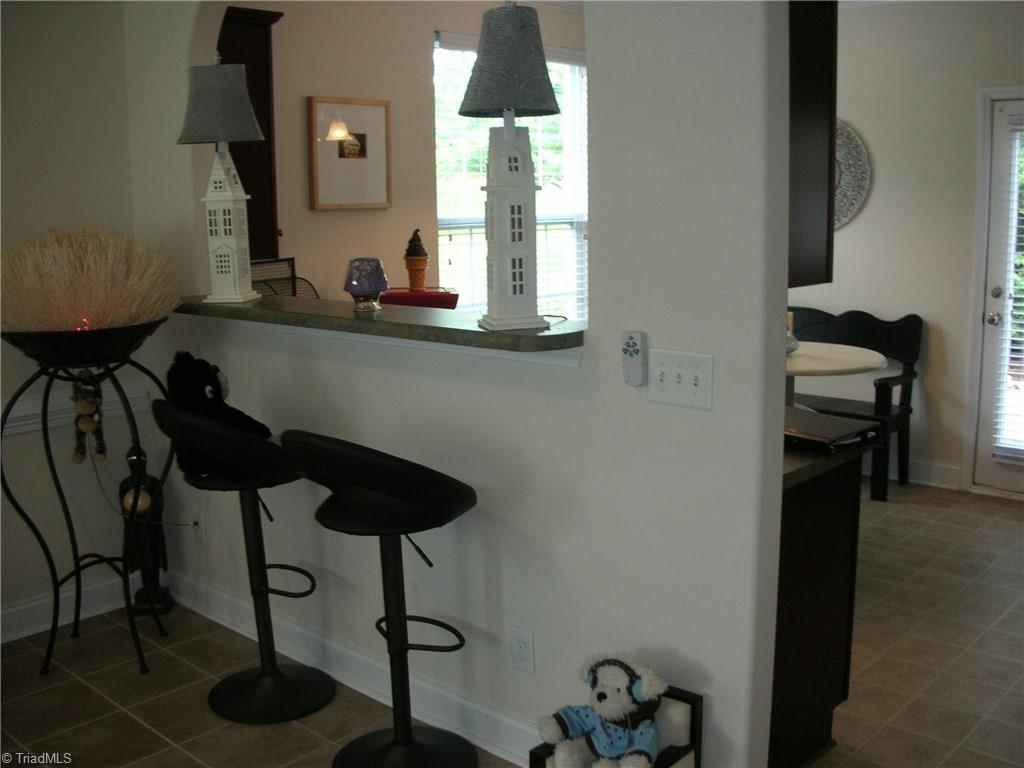 3772 Shadow Ridge Drive High Point, NC 27265 - Photo 12 of 27 This view shows the snack bar between the breakfast area and the living room.