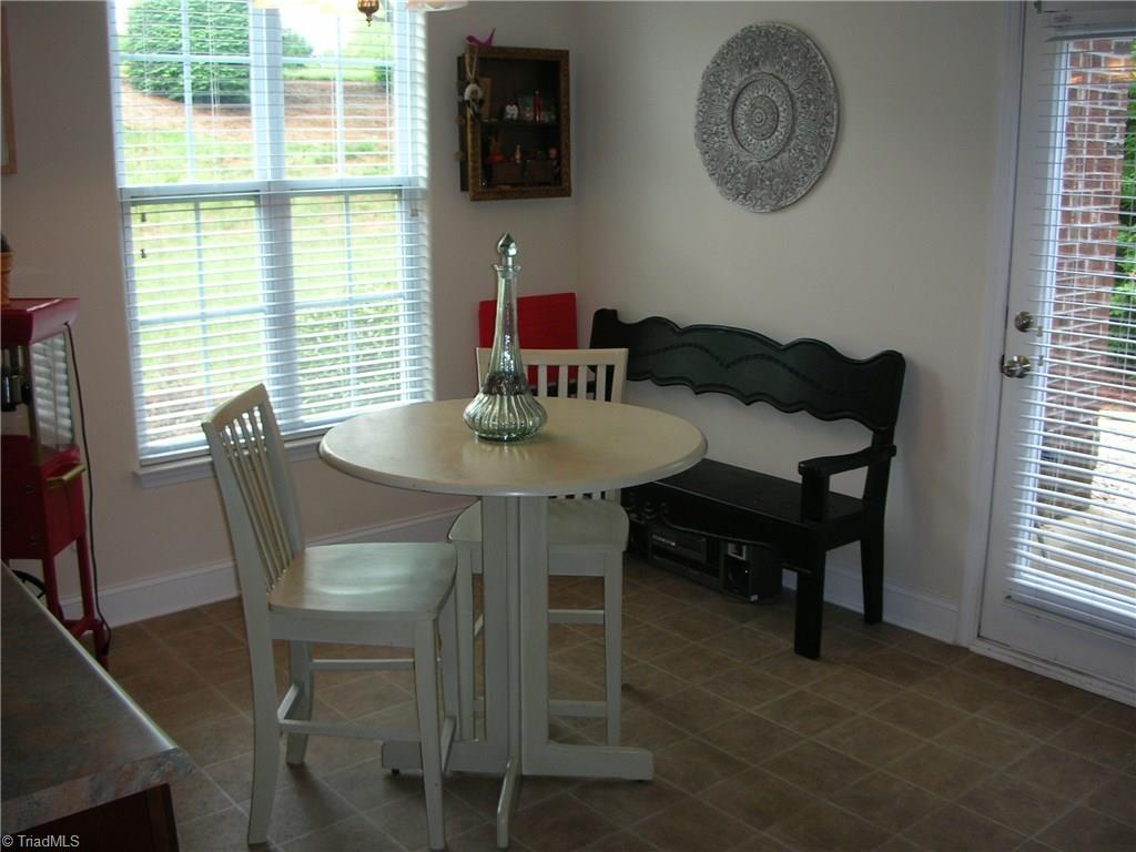 3772 Shadow Ridge Drive High Point, NC 27265 - Photo 13 of 27 Breakfast area has two windows for natural lighting so that you can enjoy a peaceful, cozy dinner. The door to the right opens to the patio.
