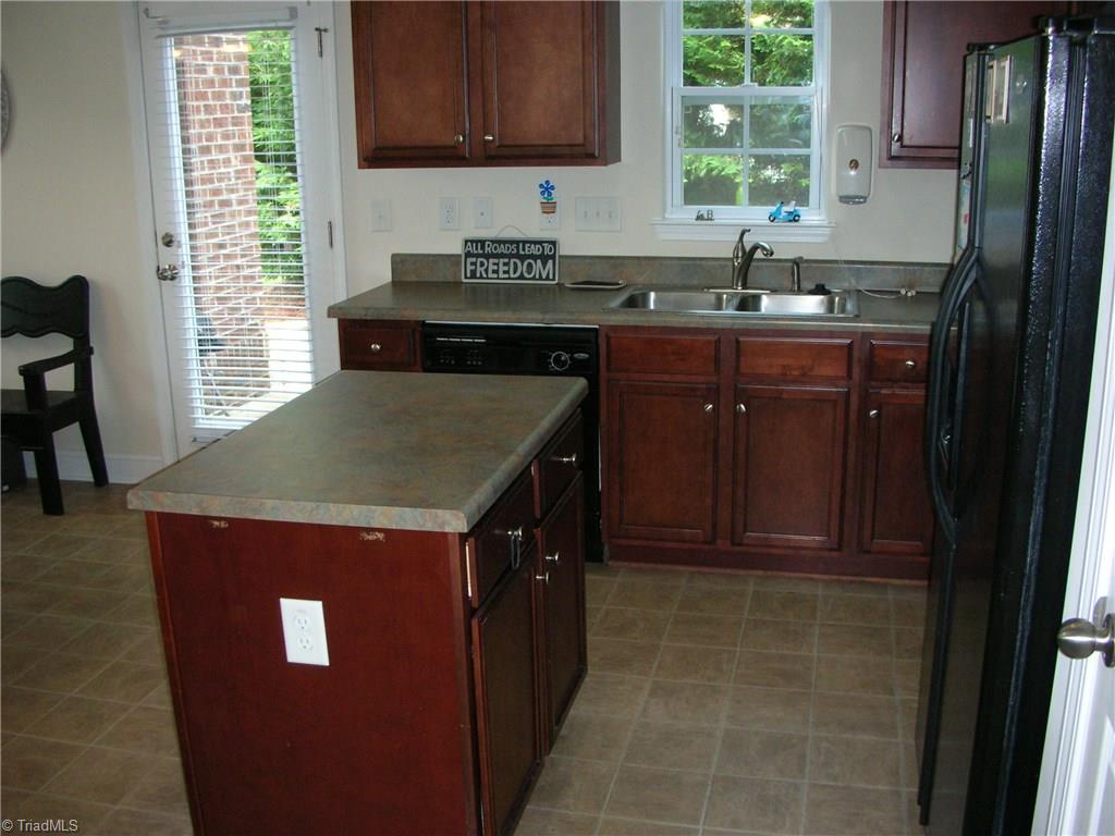 3772 Shadow Ridge Drive High Point, NC 27265 - Photo 14 of 27 Another view of the kitchen shows the door way to the patio. Is that where everyone is at?