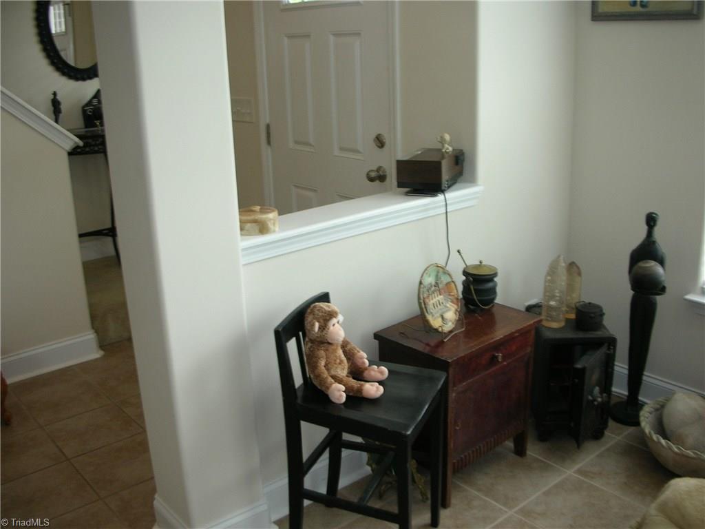 3772 Shadow Ridge Drive High Point, NC 27265 - Photo 16 of 27 View shows dividing wall between living room and entry way door. Living room has 4 windows for natural lighting.