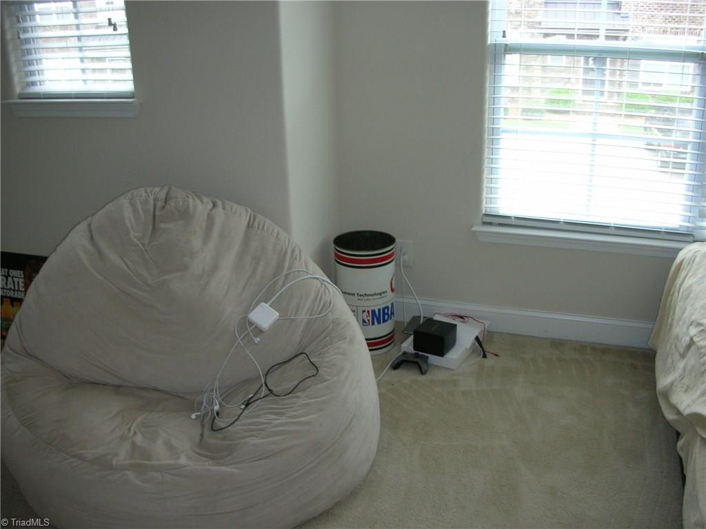 3772 Shadow Ridge Drive High Point, NC 27265 - Photo 22 of 27 View shows bedroom #3 where the floor space drops off to follow the front profile of the home.