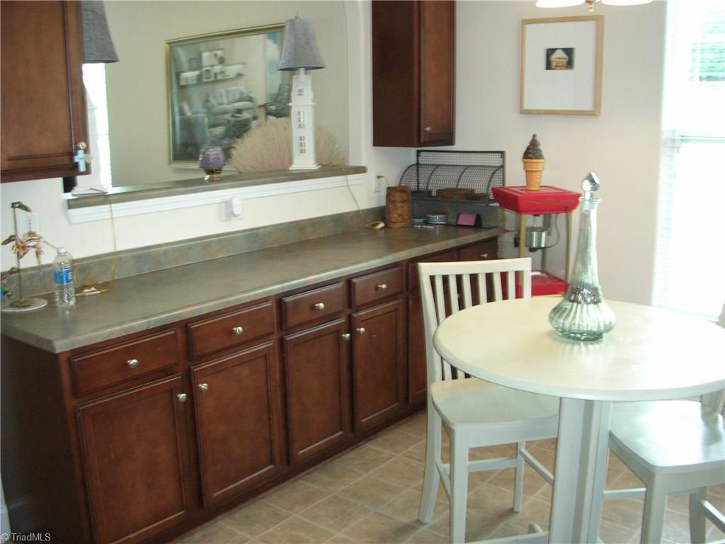 3772 Shadow Ridge Drive High Point, NC 27265 - Photo 5 of 27 The breakfast area also has cabinets for extra storage space. Very handy and close to the kitchen for quick access. Also note that the breakfast area is open to the living room to give you that open feeling.