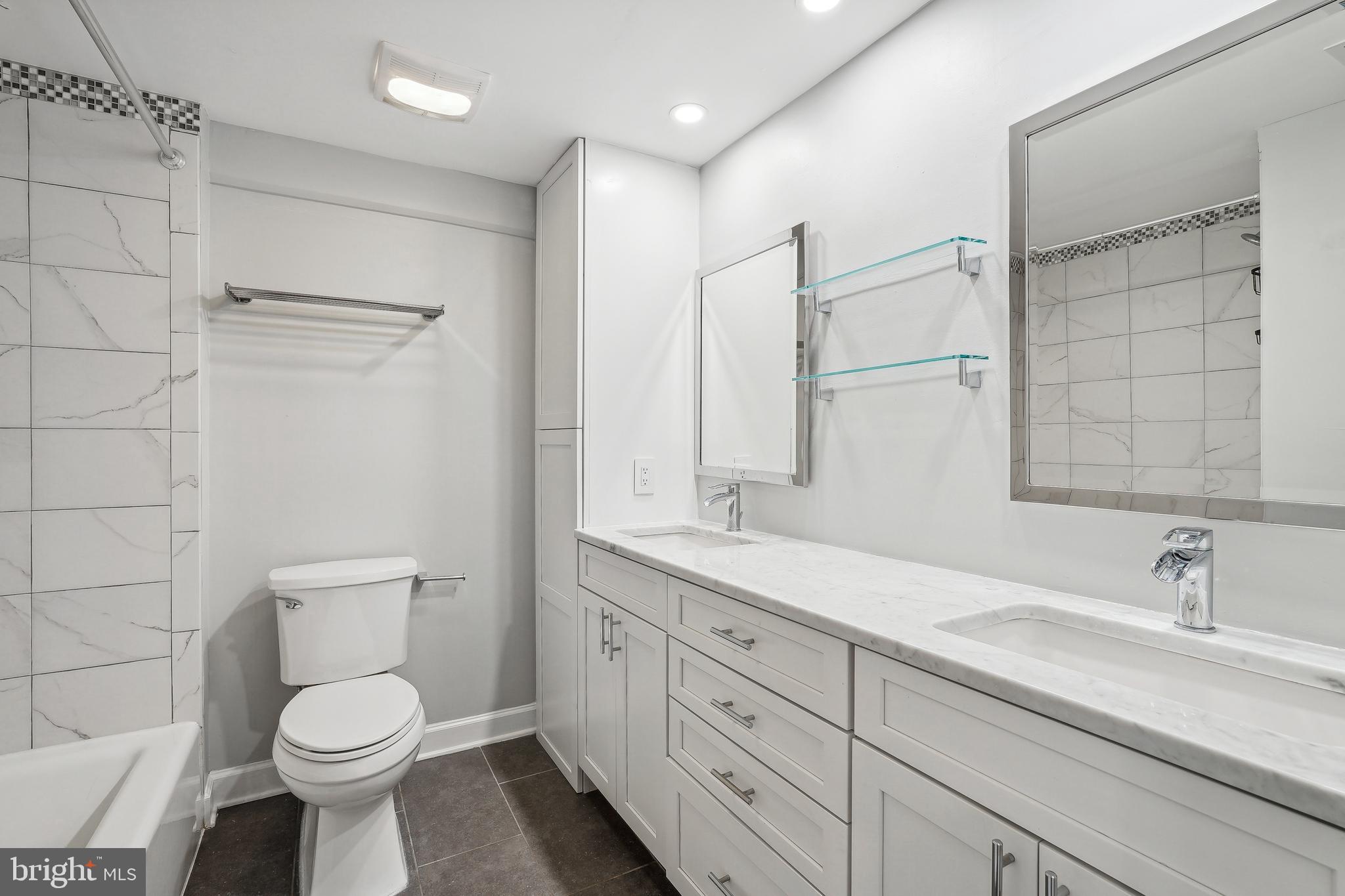 110 Cameron Street, Unit CS103 Alexandria, VA 22314 - Photo 13 of 16 Bathroom: double sinks, under cabinet storage