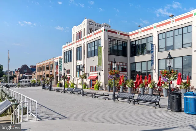 a group of people sitting in front of a building