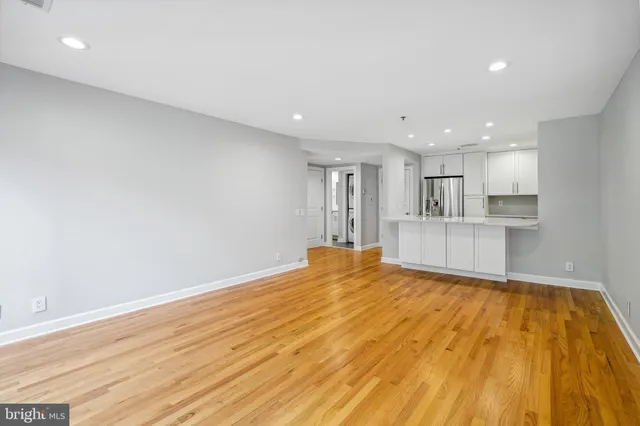 a view of a kitchen with wooden floor and kitchen