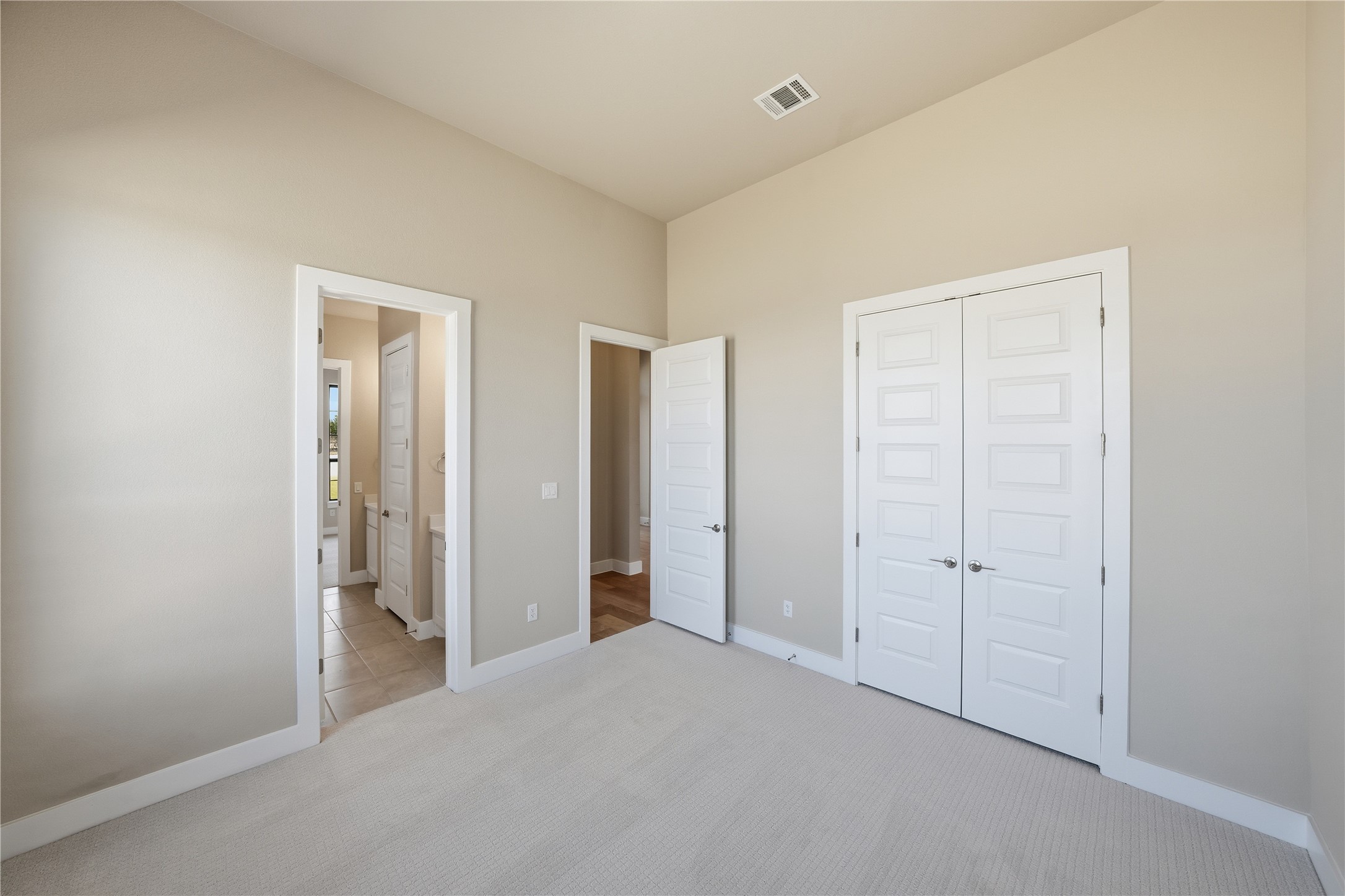 1209 Doelling Drive Georgetown, TX 78633 - Photo 22 of 31 Unfurnished bedroom with carpet, a closet, and ensuite bath