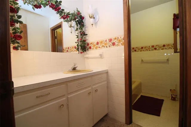 a bathroom with a sink and a mirror