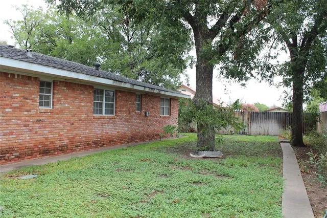 a backyard of a house with lots of green space