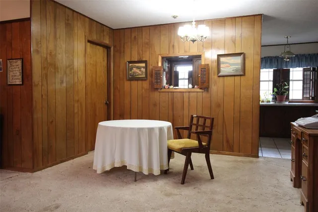 a bedroom with a bed and a chair