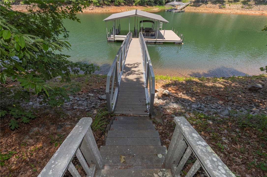 202 Plantation Point Anderson, SC 29625 - Photo 45 of 48 A private boat dock and covered slip beckon for lakeside living.