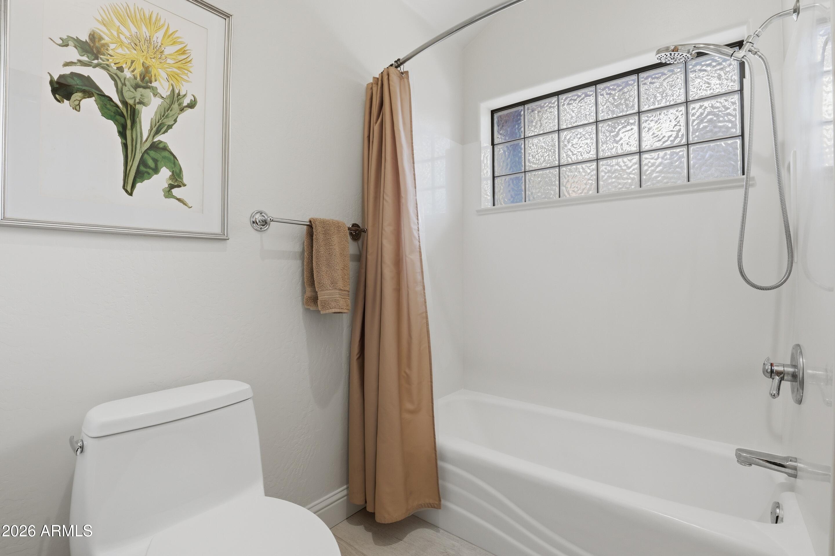 2502 East Elk Run Court Payson, AZ 85541 - Photo 16 of 27 a bathroom with a toilet and a shower