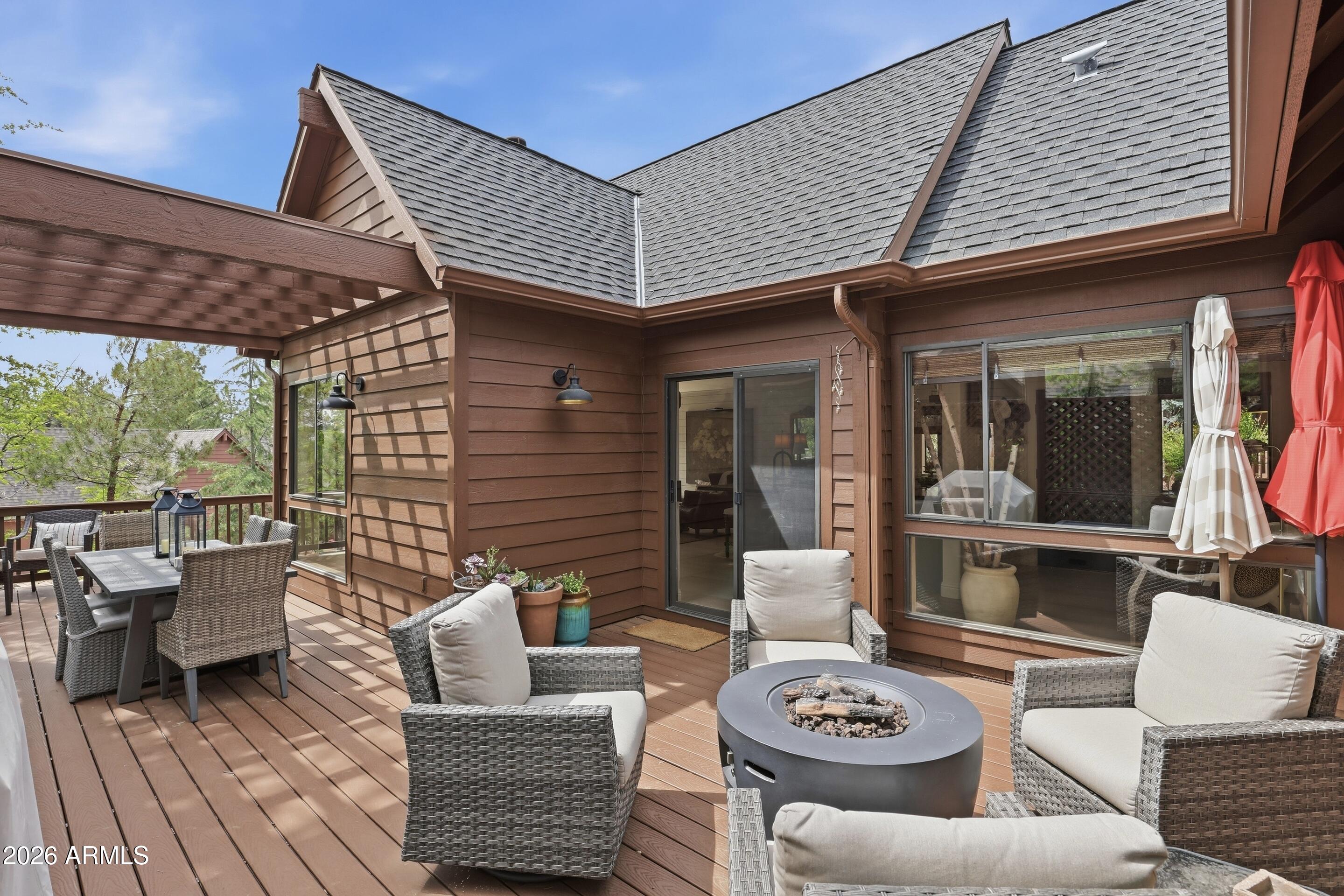 2502 East Elk Run Court Payson, AZ 85541 - Photo 20 of 27 a view of a patio with couches chairs and wooden floor