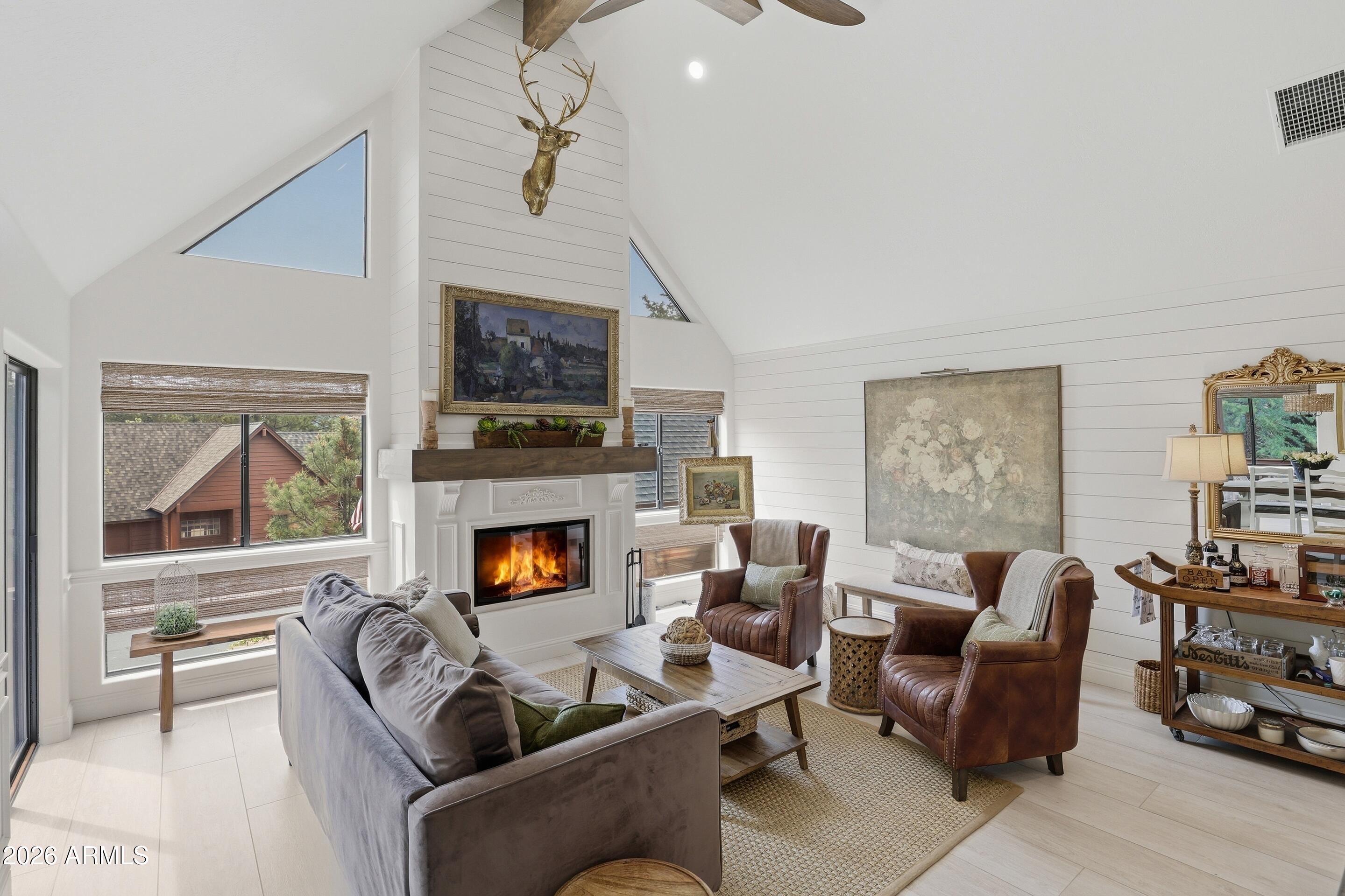 2502 East Elk Run Court Payson, AZ 85541 - Photo 5 of 27 a living room with furniture and a fireplace