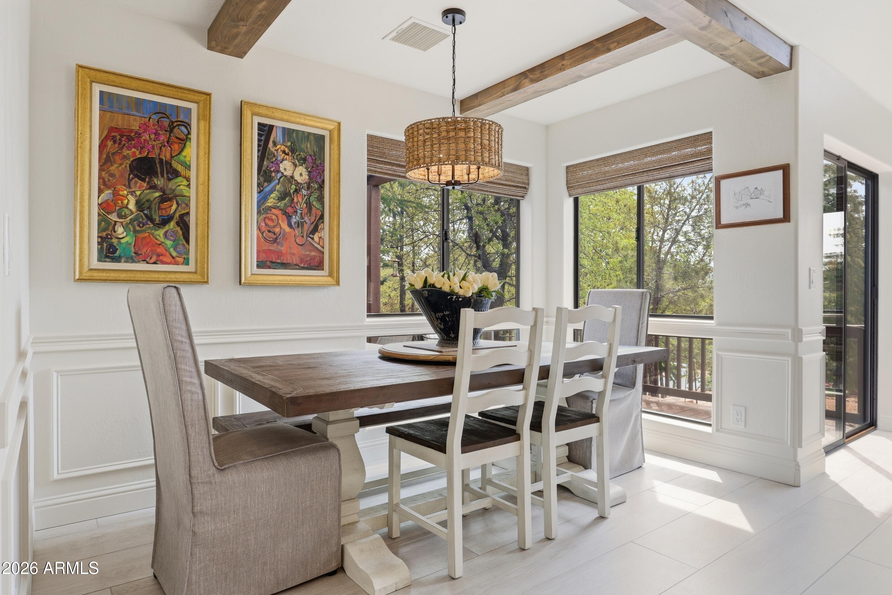 2502 East Elk Run Court Payson, AZ 85541 - Photo 10 of 27 a dining room with furniture a chandelier and window