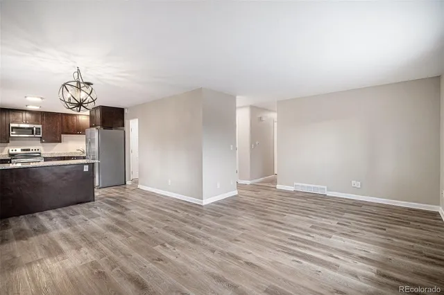 a view of kitchen with wooden floor