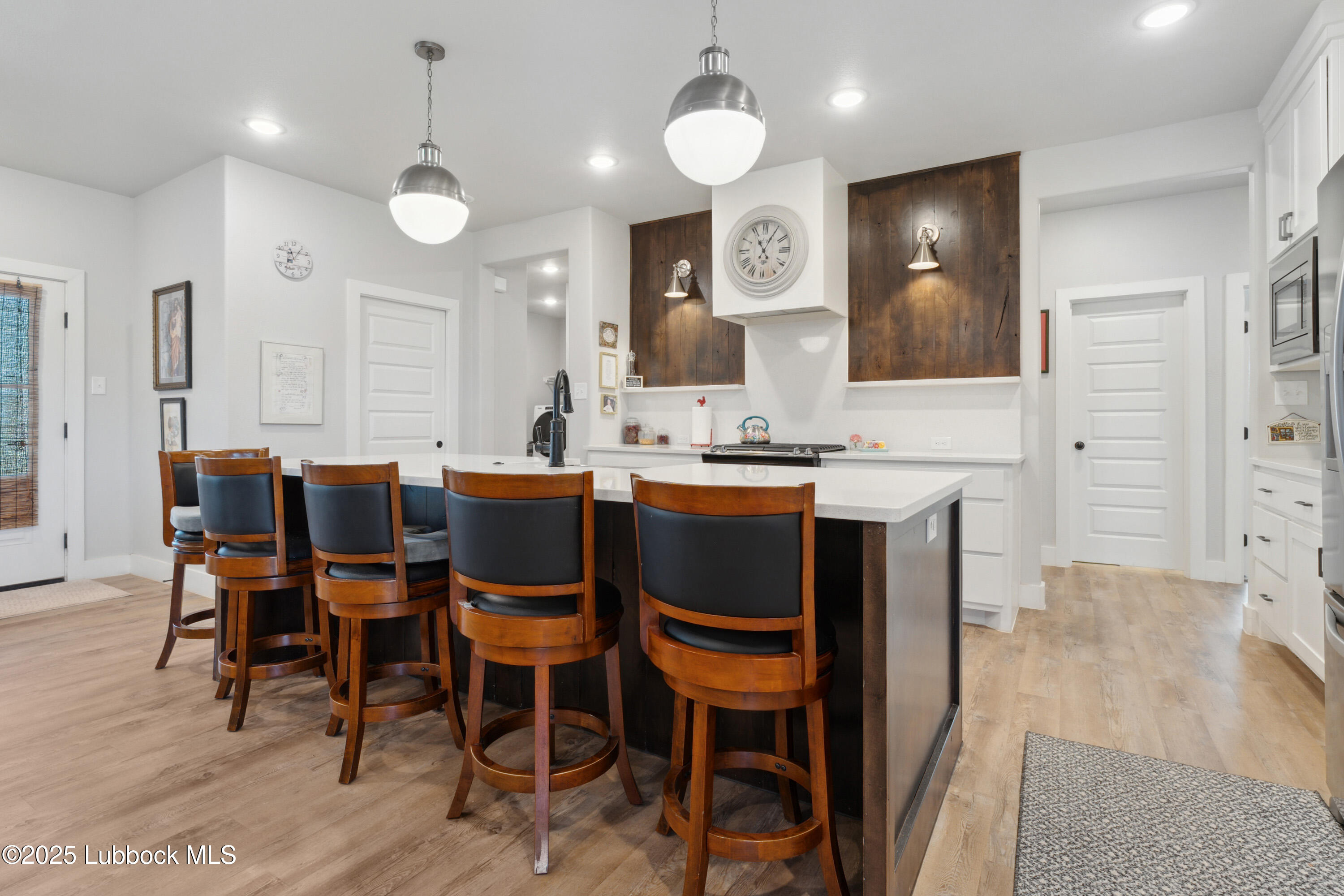 2915 137th Street Lubbock, TX 79423 - Photo 13 of 40 a large kitchen with a table and chairs