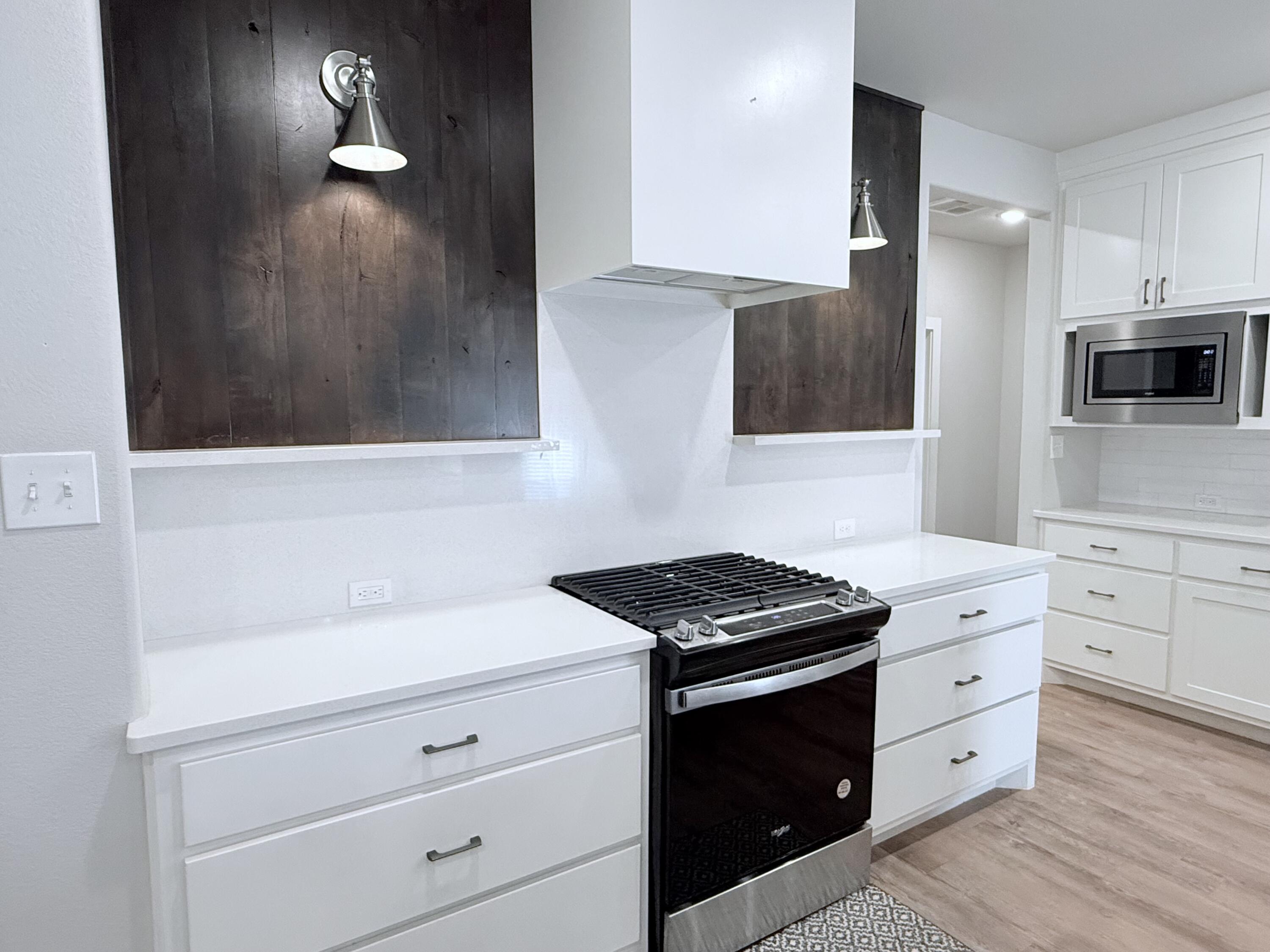 2915 137th Street Lubbock, TX 79423 - Photo 22 of 40 a kitchen with cabinets and appliances