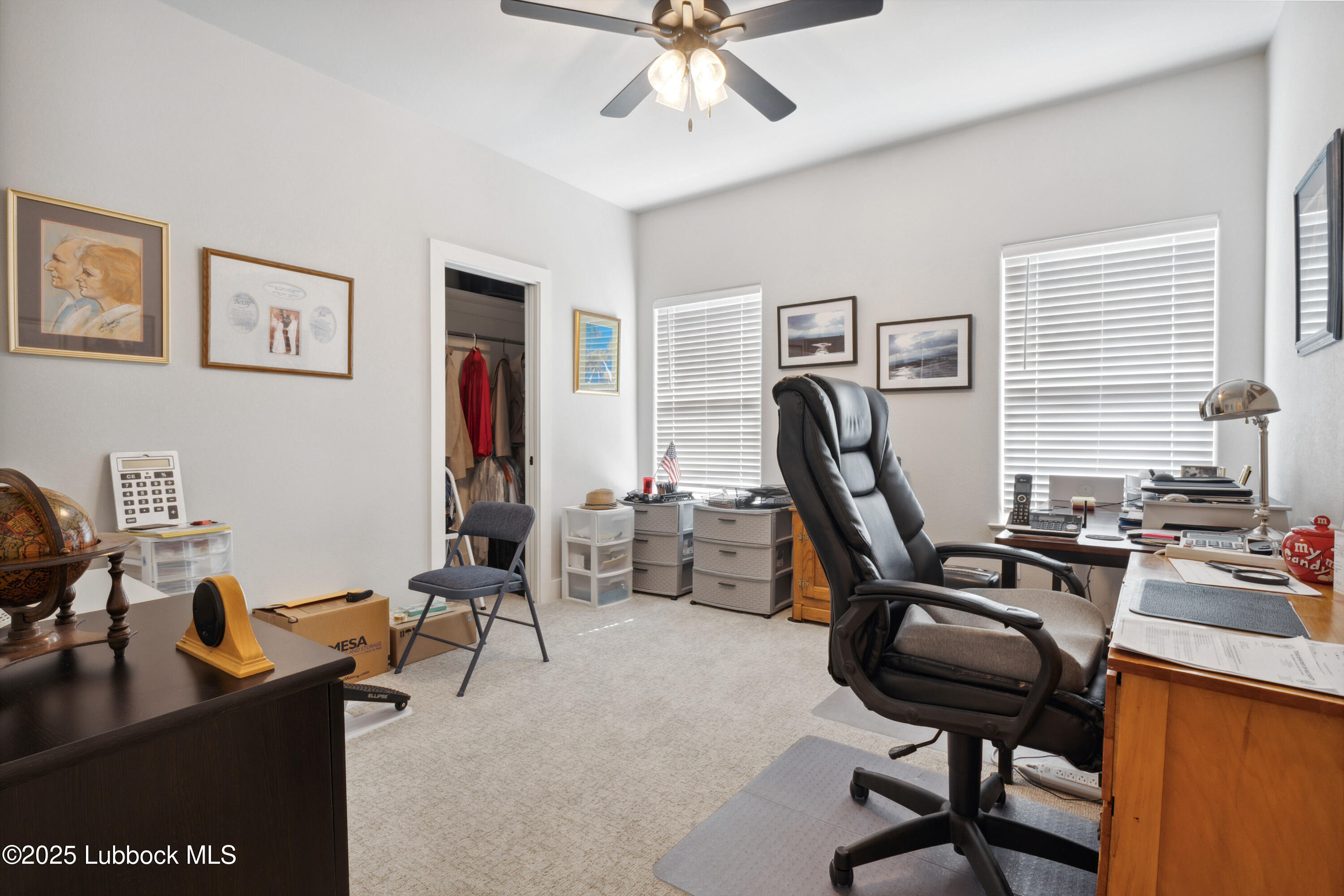 2915 137th Street Lubbock, TX 79423 - Photo 25 of 40 a view of a workspace with furniture and a window