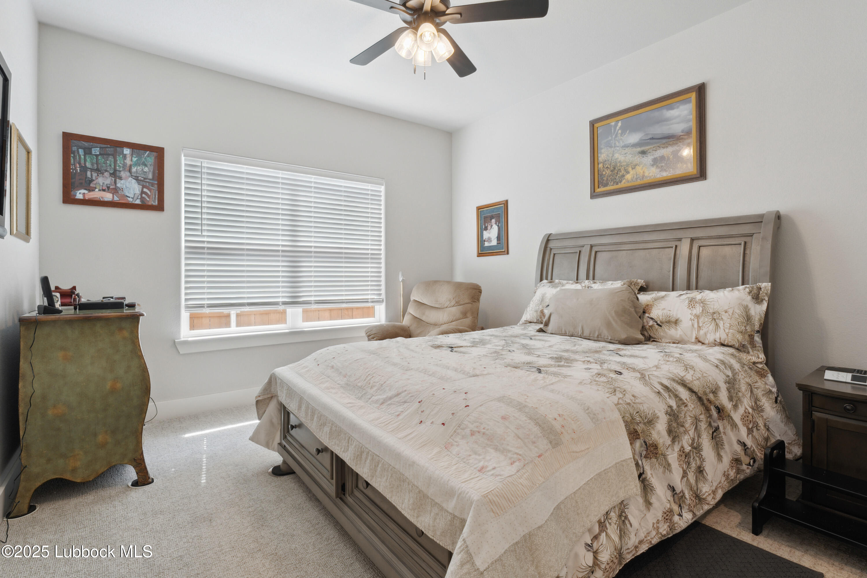 2915 137th Street Lubbock, TX 79423 - Photo 27 of 40 a bedroom with a bed and a window