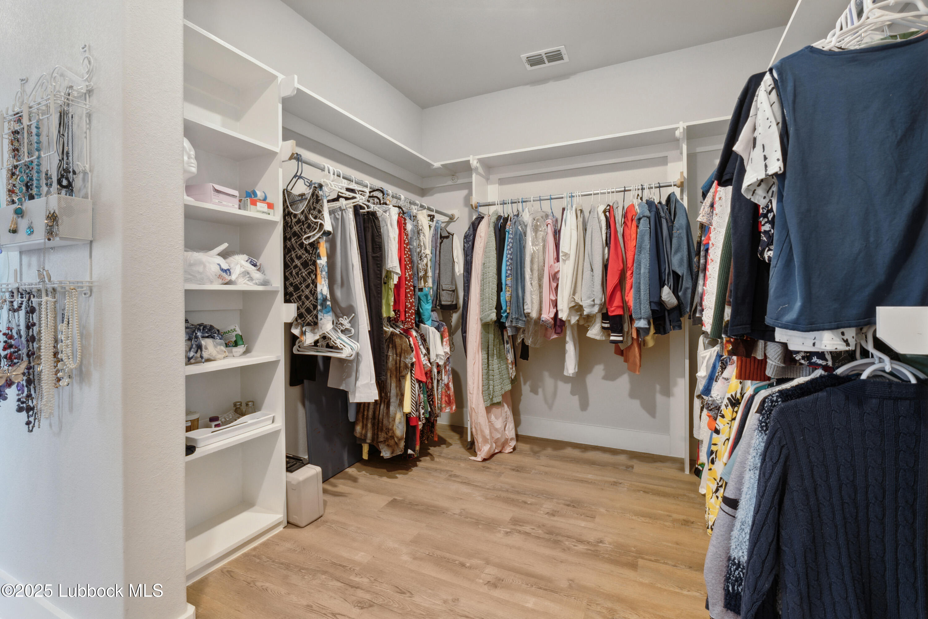 2915 137th Street Lubbock, TX 79423 - Photo 34 of 40 a view of walk in closet with clothes