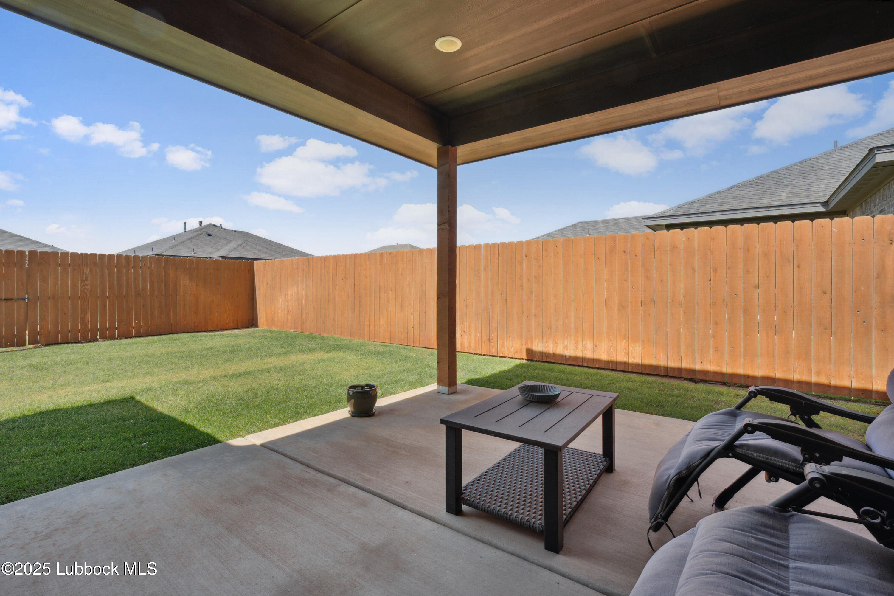 2915 137th Street Lubbock, TX 79423 - Photo 38 of 40 a view of a two chairs in the back yard