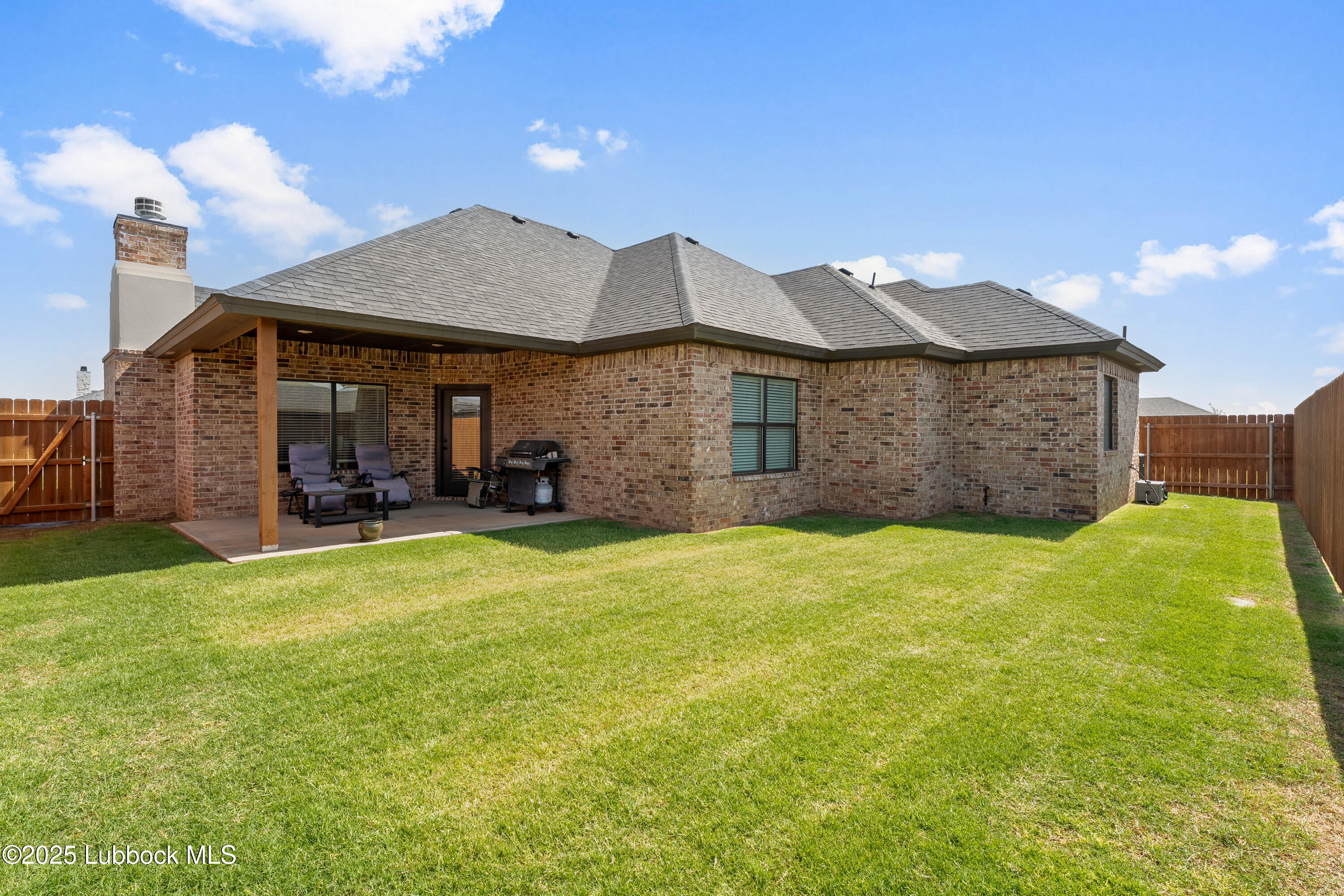 2915 137th Street Lubbock, TX 79423 - Photo 40 of 40 a front view of a house with a garden and plants