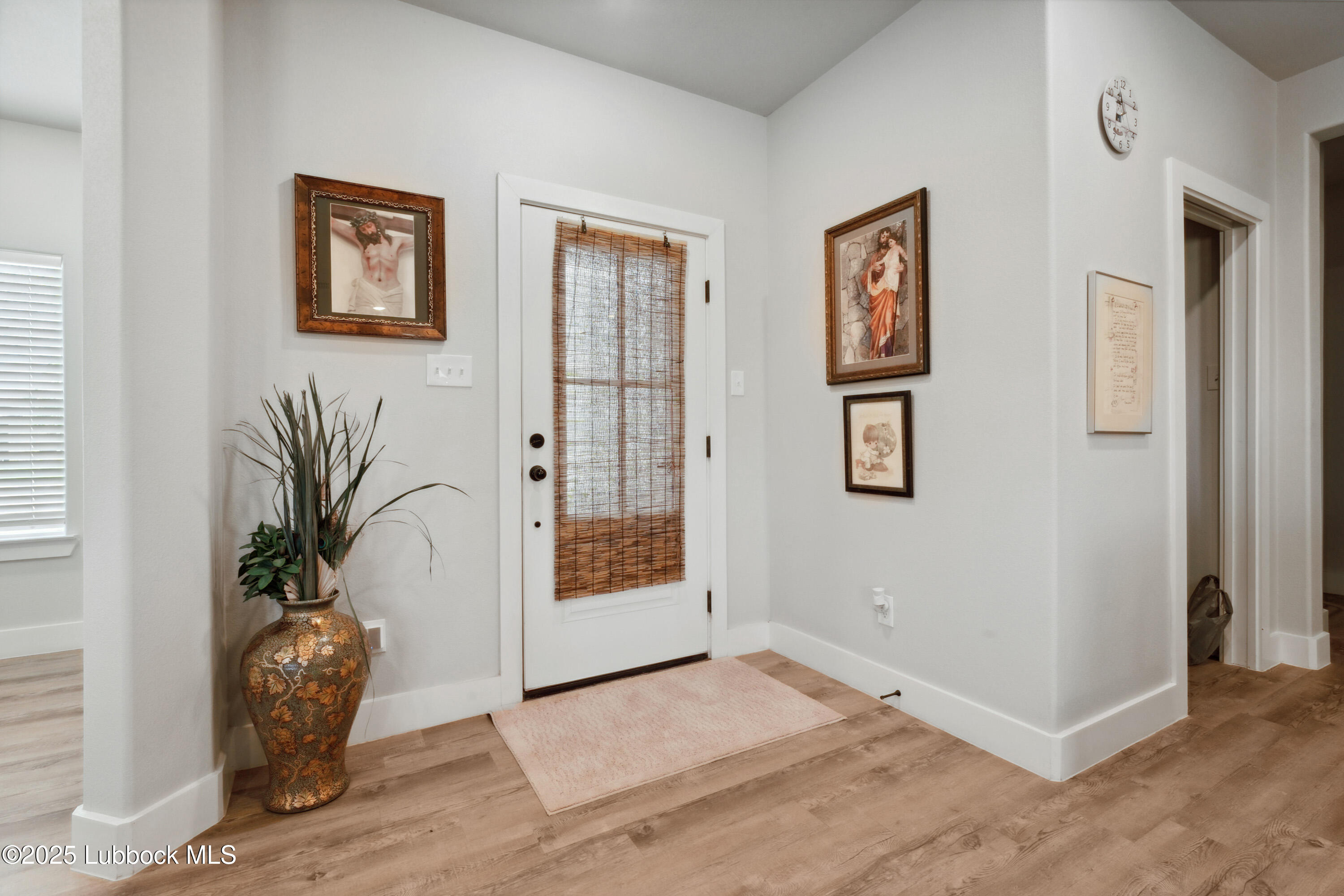 2915 137th Street Lubbock, TX 79423 - Photo 4 of 40 a view of front door with potted plant
