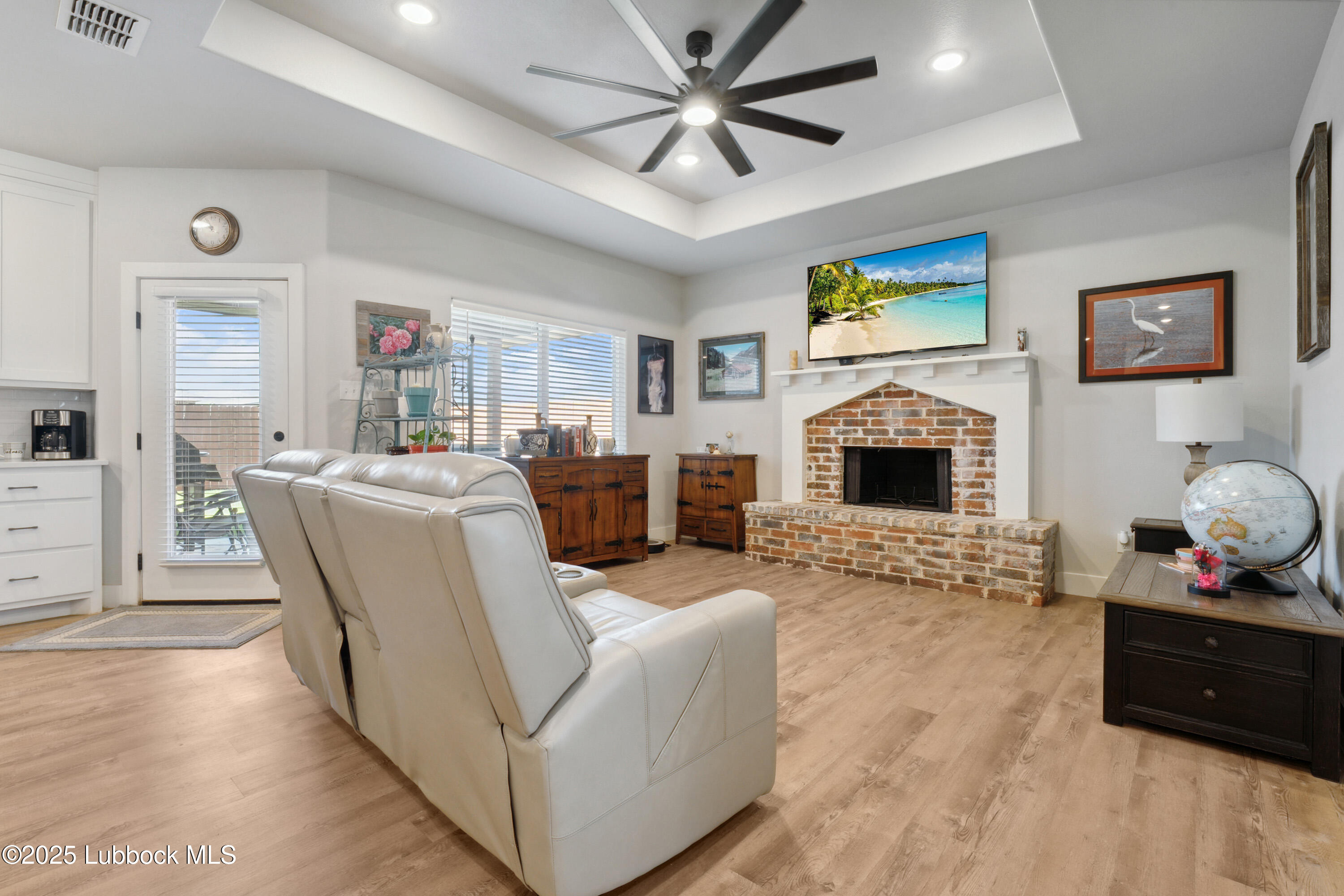 2915 137th Street Lubbock, TX 79423 - Photo 8 of 40 a living room with furniture and a fireplace