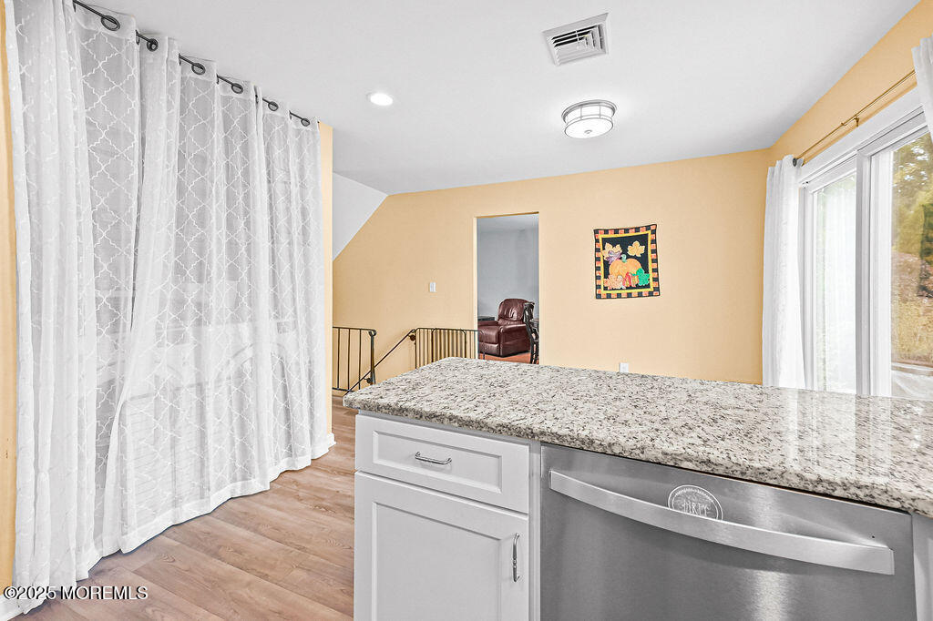 9 Tralee Road Hazlet, NJ 07730 - Photo 18 of 40 a bathroom with a granite countertop sink and a mirror