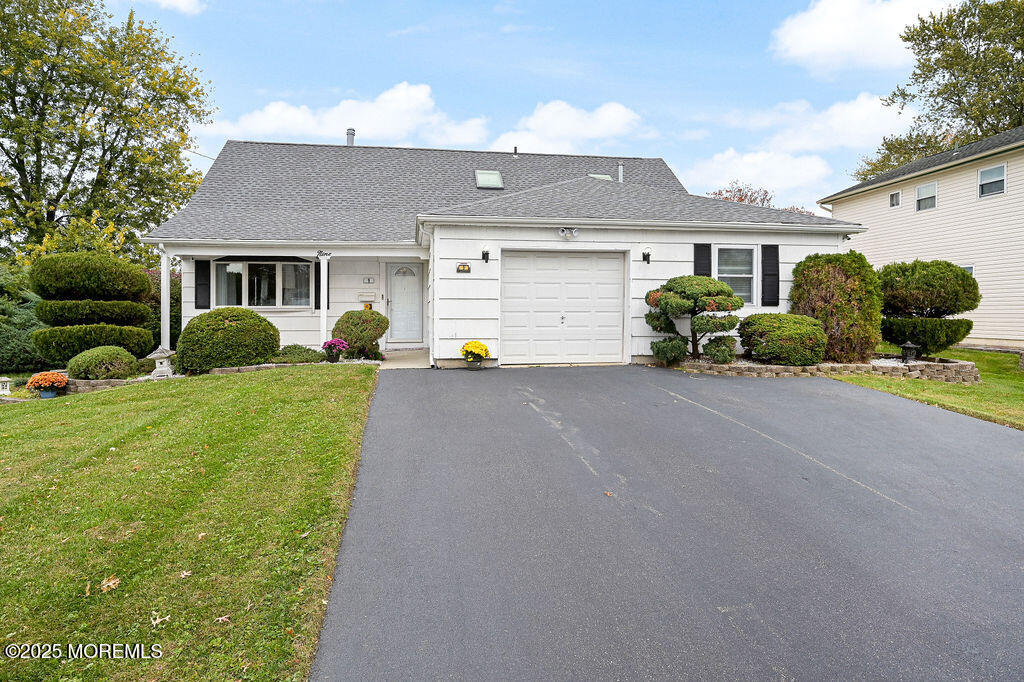 9 Tralee Road Hazlet, NJ 07730 - Photo 2 of 40 a front view of a house with a yard and garage